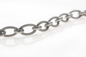 Silver bracelet with calza and diamond cutted rings twisted together rhodium plated.  - Thumb